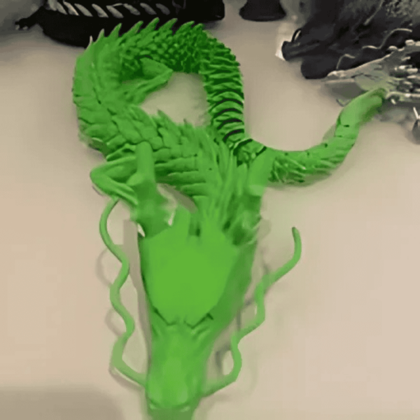 Juguete antiestrés impreso con modelo 3D de dragón articulado